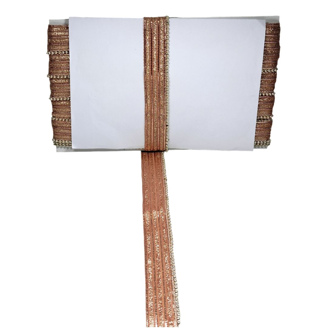 Decorative table runner with metallic trim on a white background