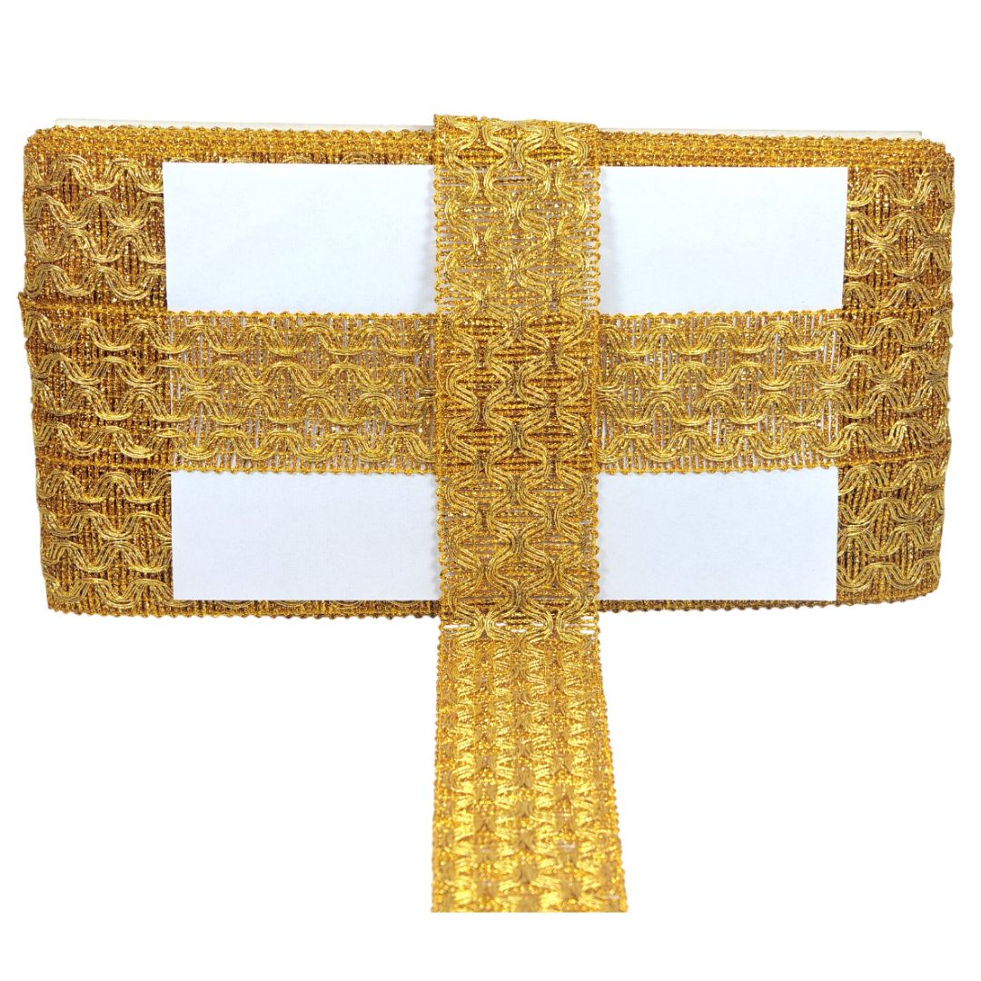 Gold decorative cross on a white background