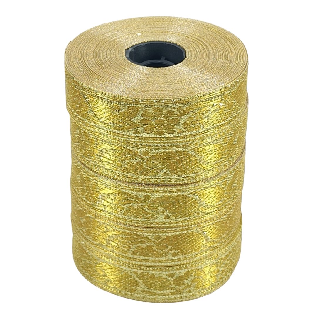 Gold metallic ribbon roll on a white background