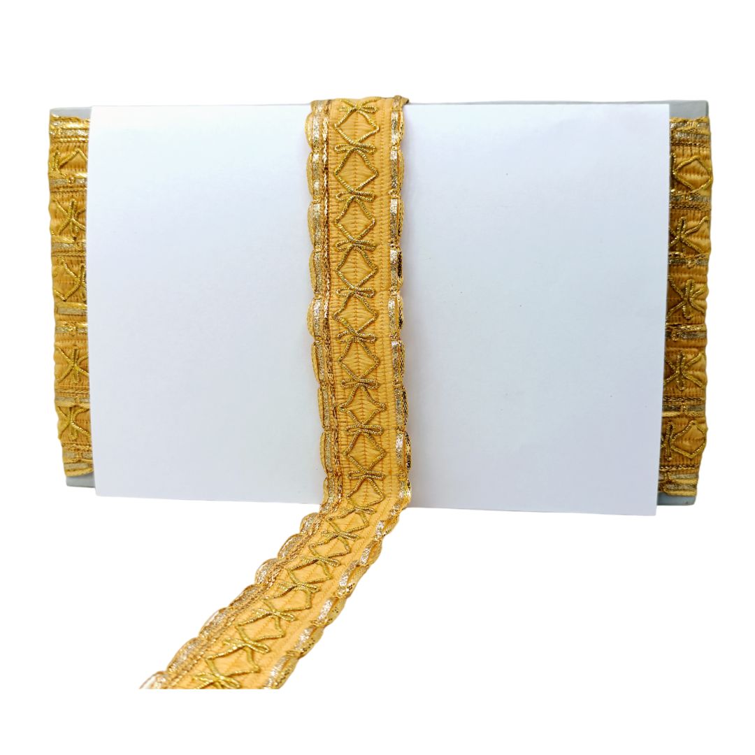 Gold decorative trim on a white background