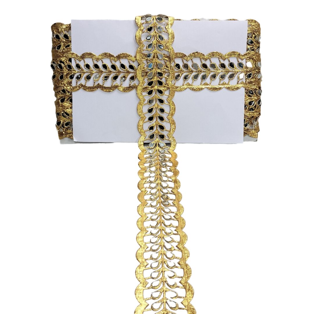 Decorative gold ribbon with intricate patterns on a white background