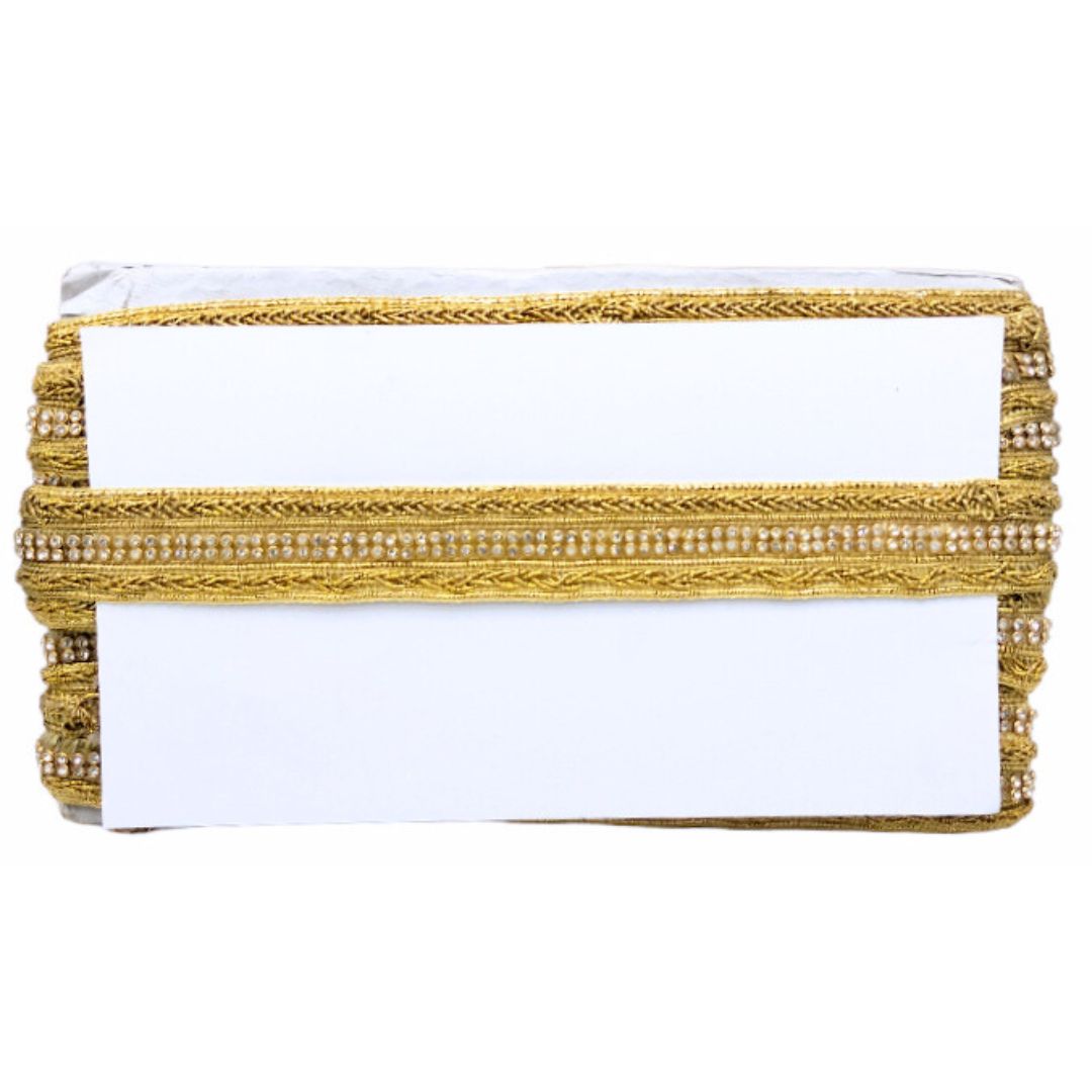 White clutch with gold beaded trim on a white background