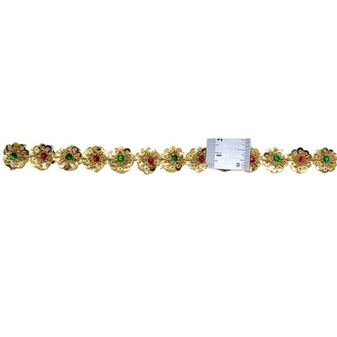 Gold belt with floral designs and red and green gemstones, displayed on a white background.