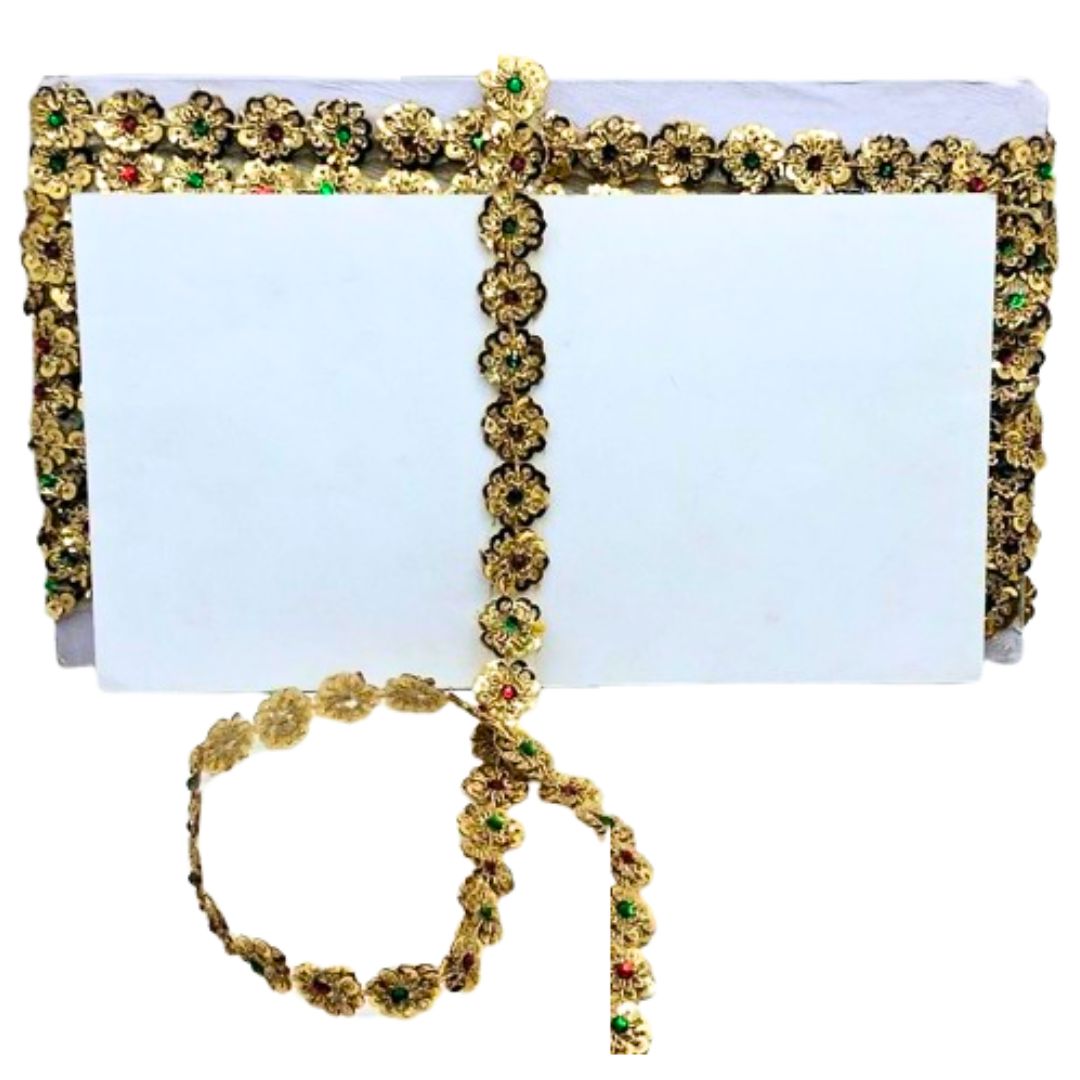 Decorative headband and hair accessories with gold and green embellishments on a white background