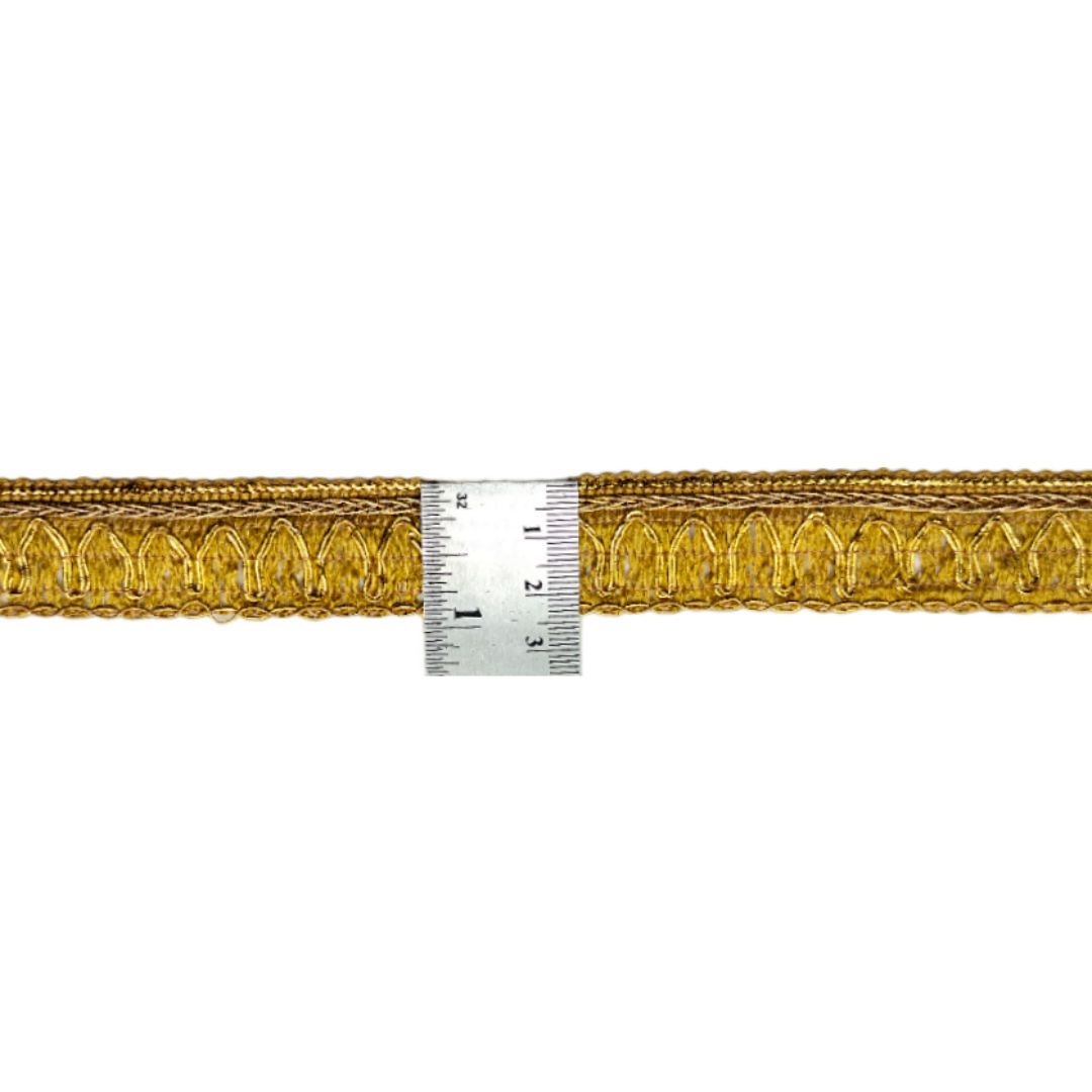 Gold decorative trim with a ruler for measurement on a white background