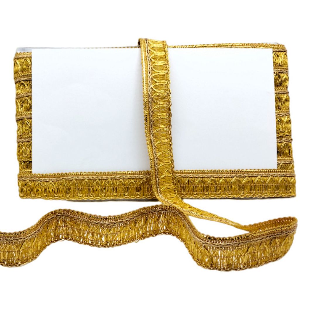 White clutch with gold trim on a white background