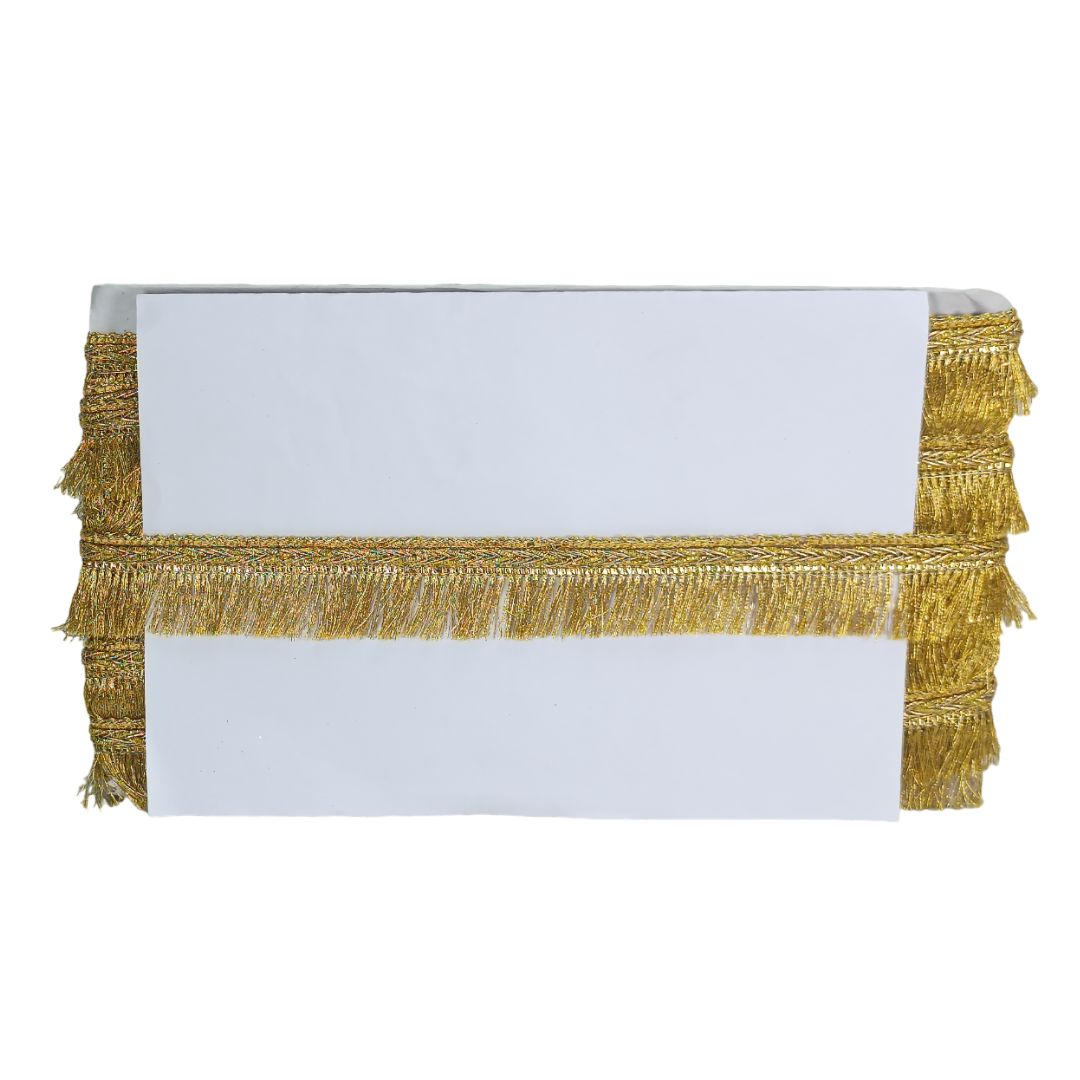 Gold fringe table runner on a white background