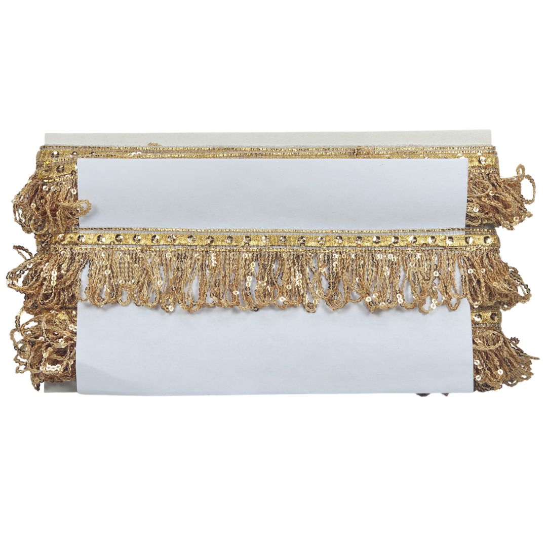 White clutch with gold fringe on a white background