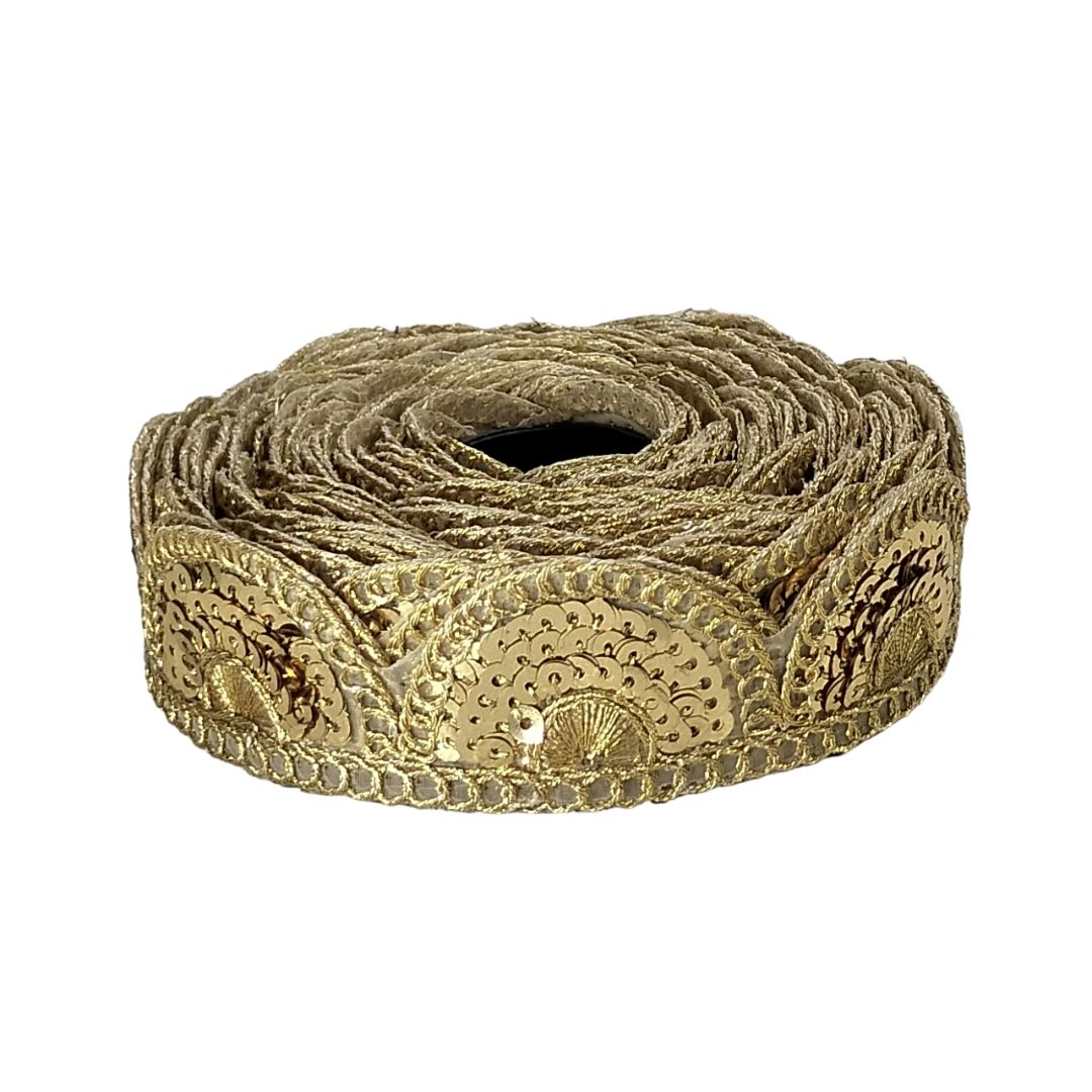 Roll of decorative gold lace on a white background