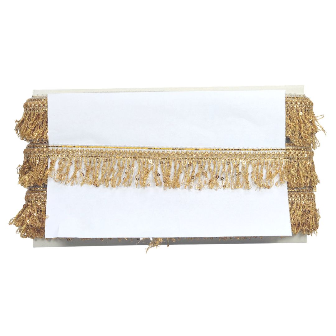 White card with gold fringes on a white background