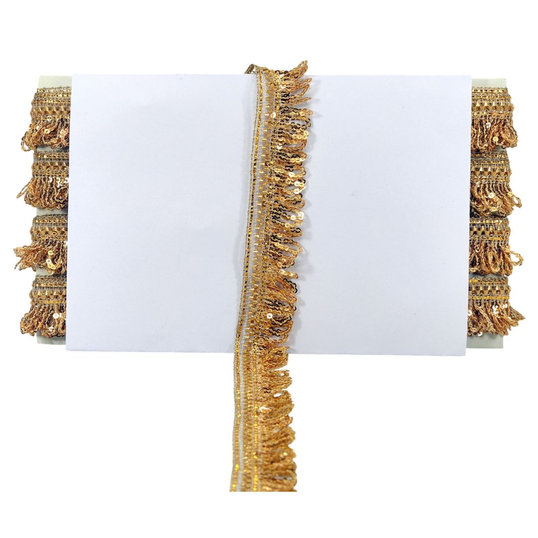 Gold decorative trim with tassels on a white background