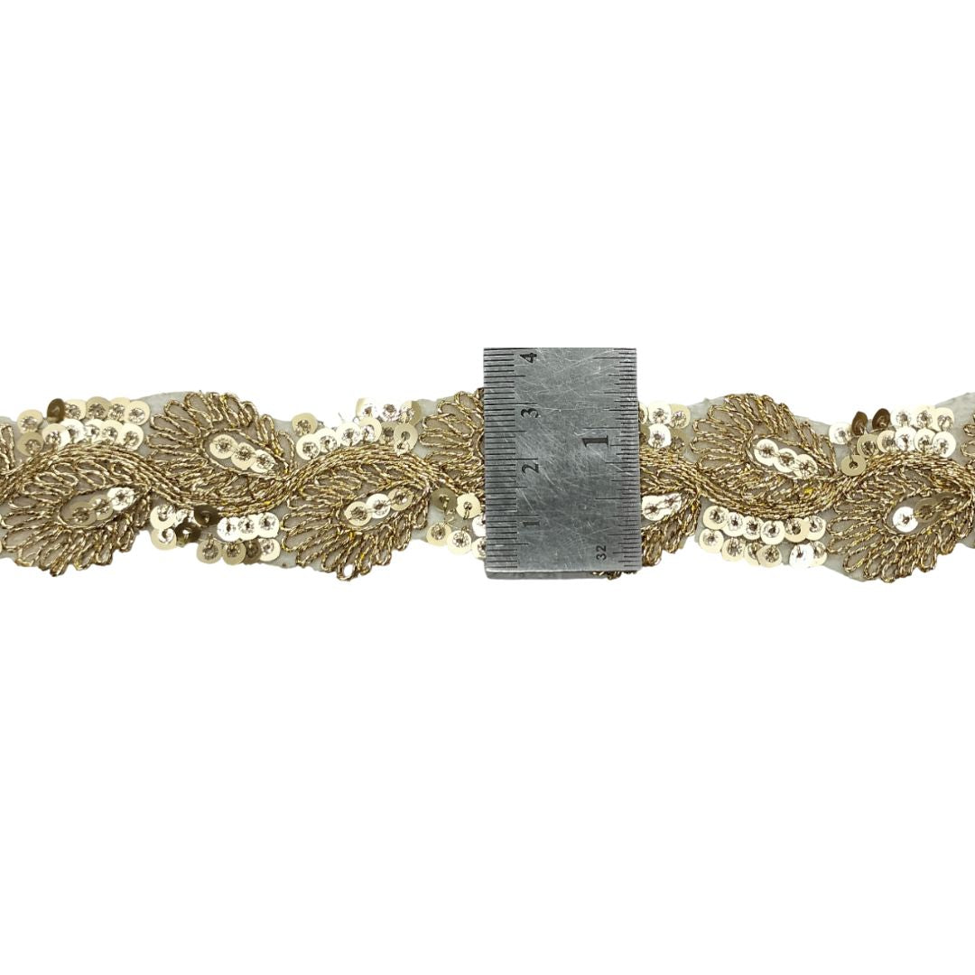 Gold sequin belt with a ruler for size reference on a white background