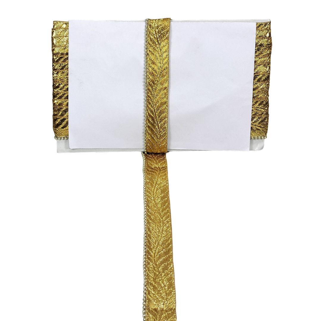 White napkin with gold decorative trim on a white background