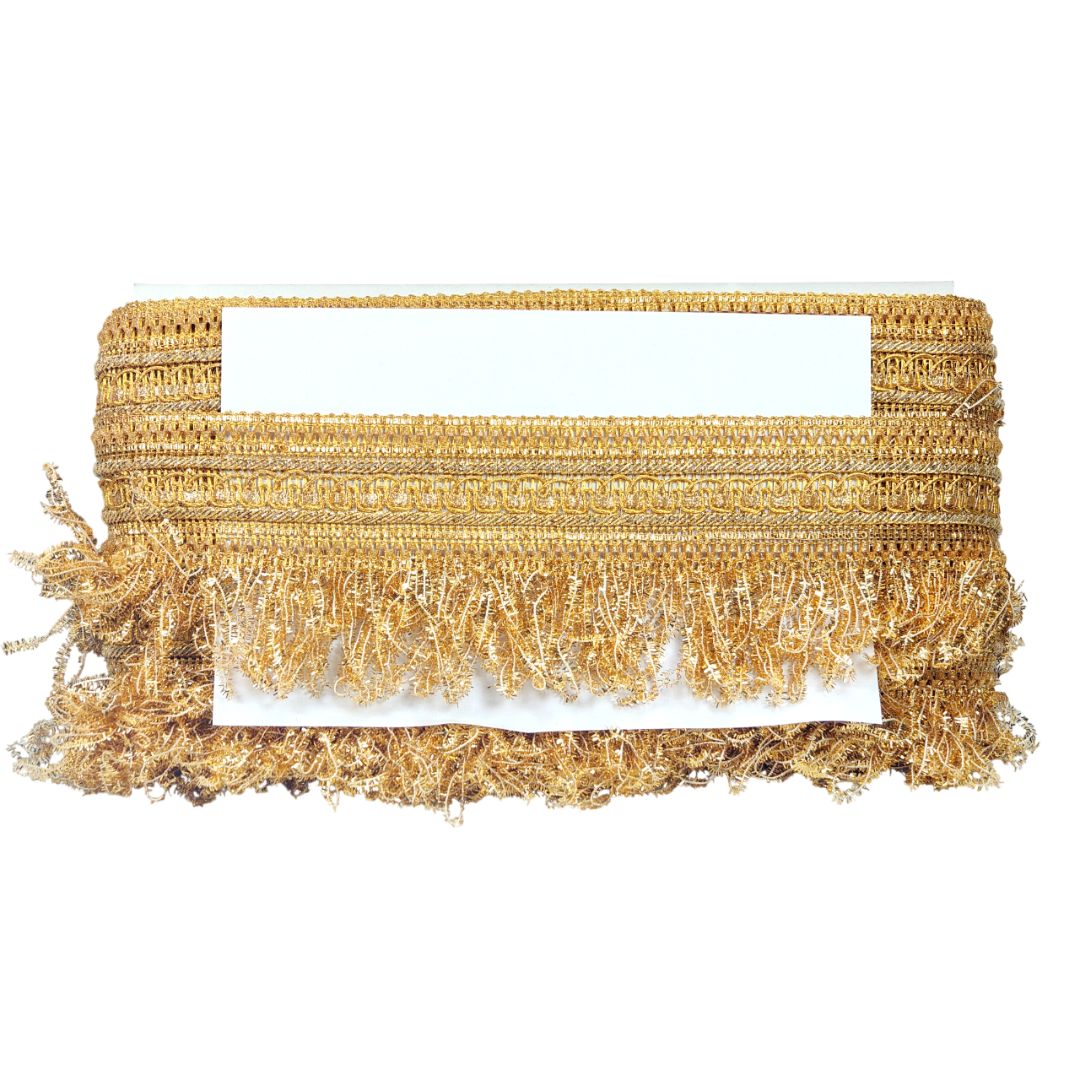 Gold woven clutch with fringe on a white background