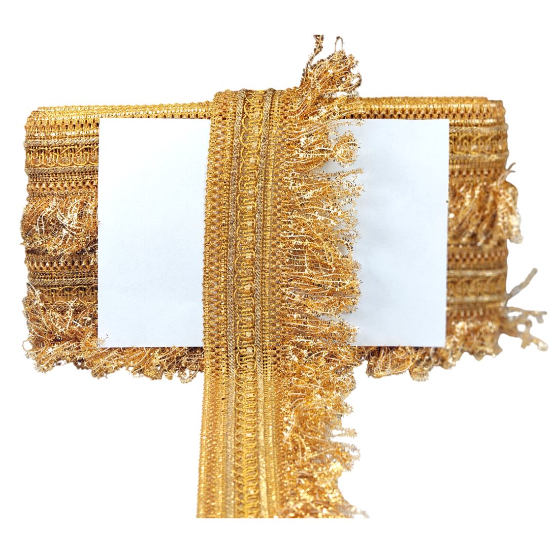 Gold fringe table runner on a white background