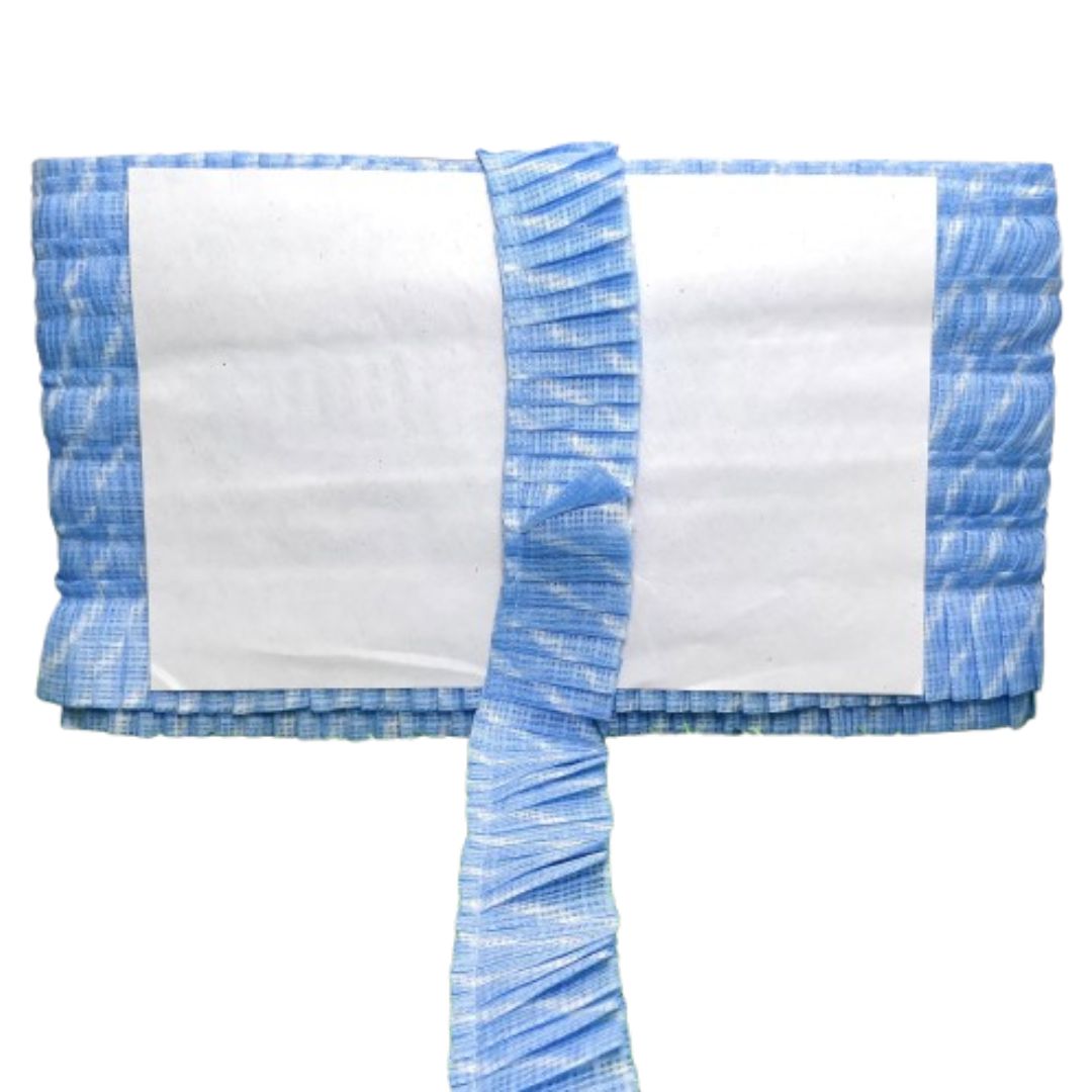 White fabric with blue ruffled trim on a white background