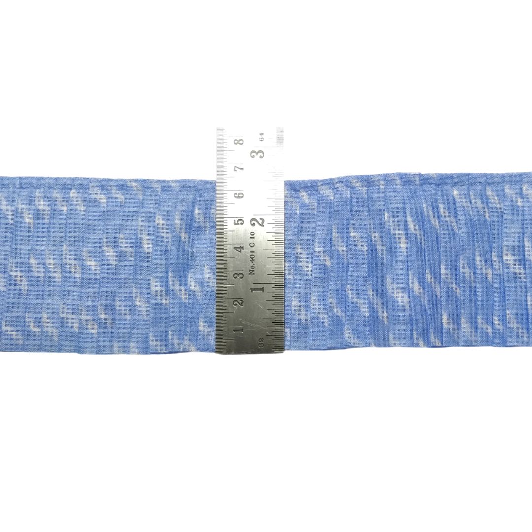 Blue webbing with a metal ruler for measurement on a white background