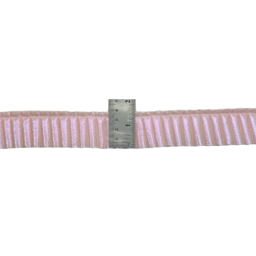 Striped ribbon with a ruler for measurement on a white background