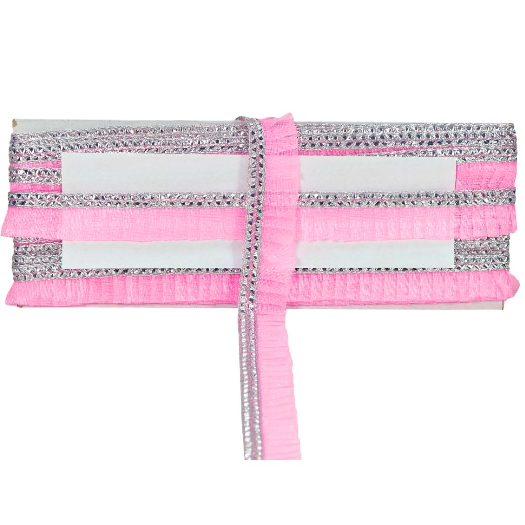 Pink and silver striped fabric with a white center on a white background