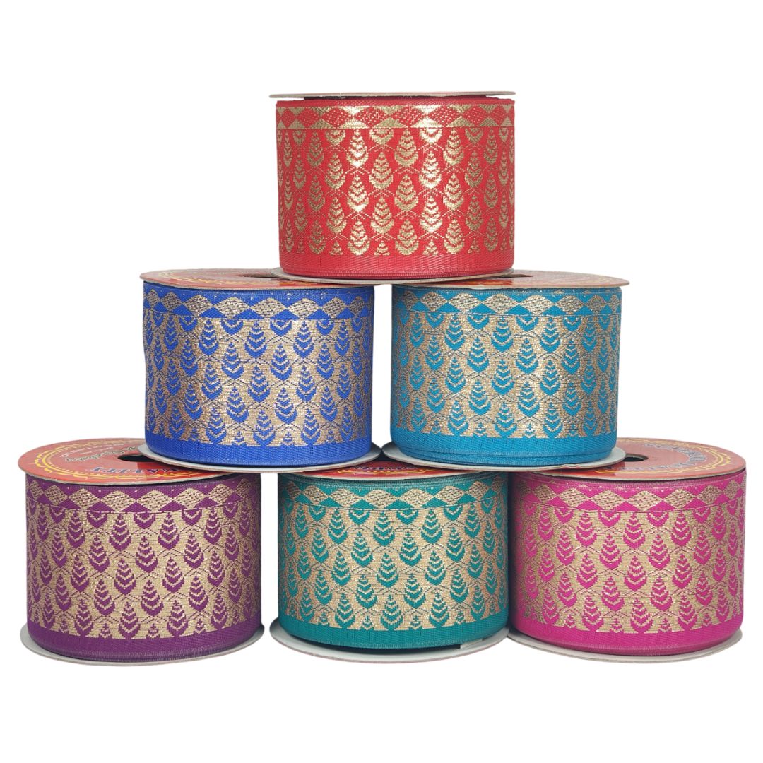 Set of six ribbon spools with gold pattern on a white background
