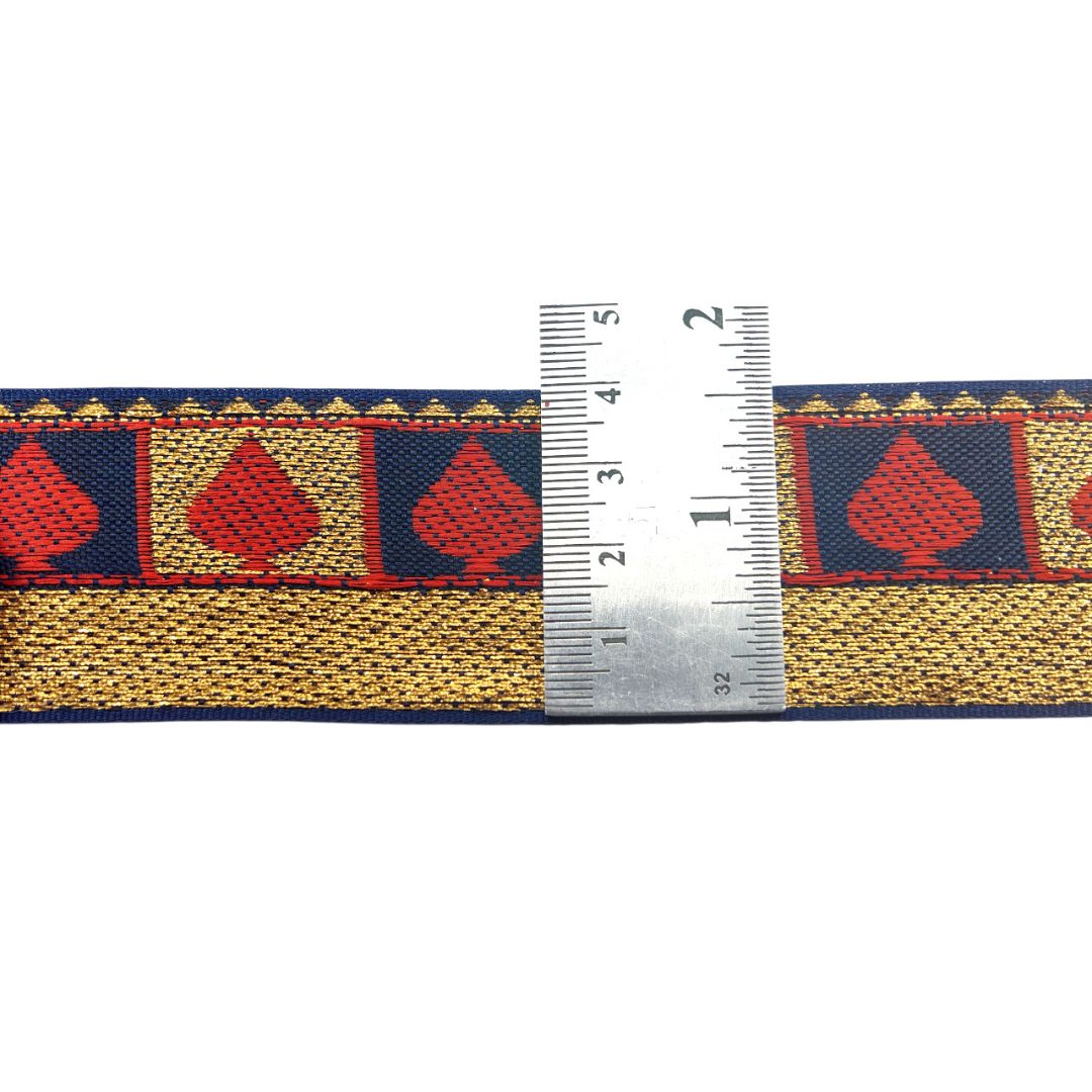 Fabric ribbon with red spade design and measurement ruler on a white background