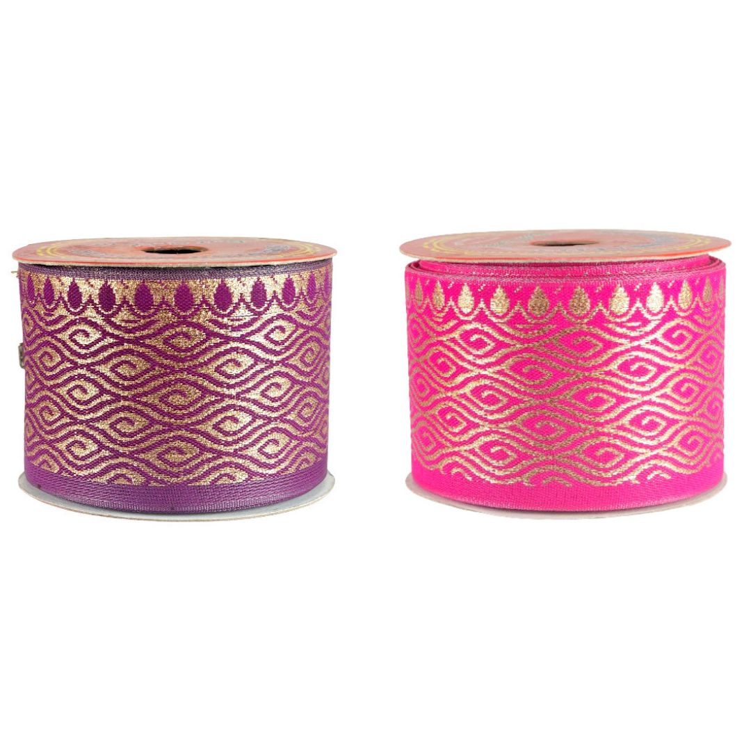 Two rolls of ribbon with gold and purple patterns on a white background