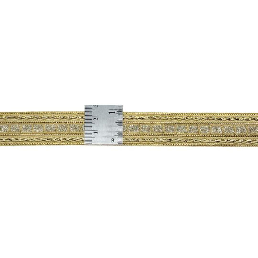 Gold and silver watch band on a white background
