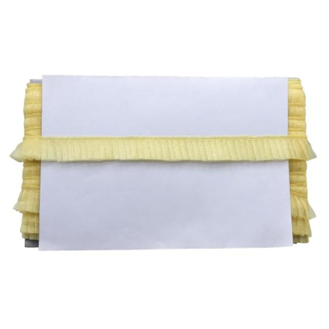 Yellow ruffled clutch bag with a white card on a white background