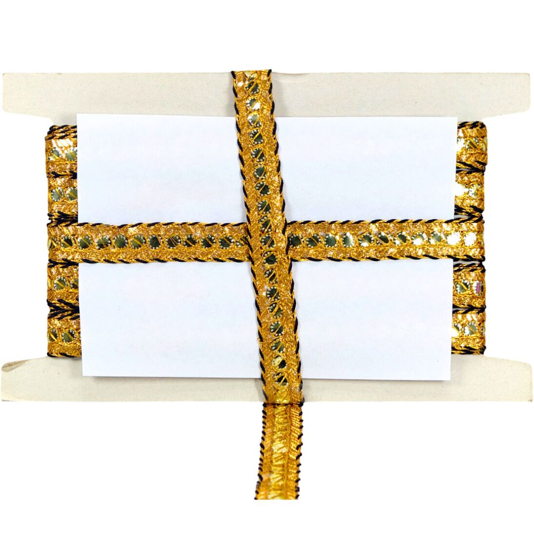 Decorative gold ribbon with a white card on a white background