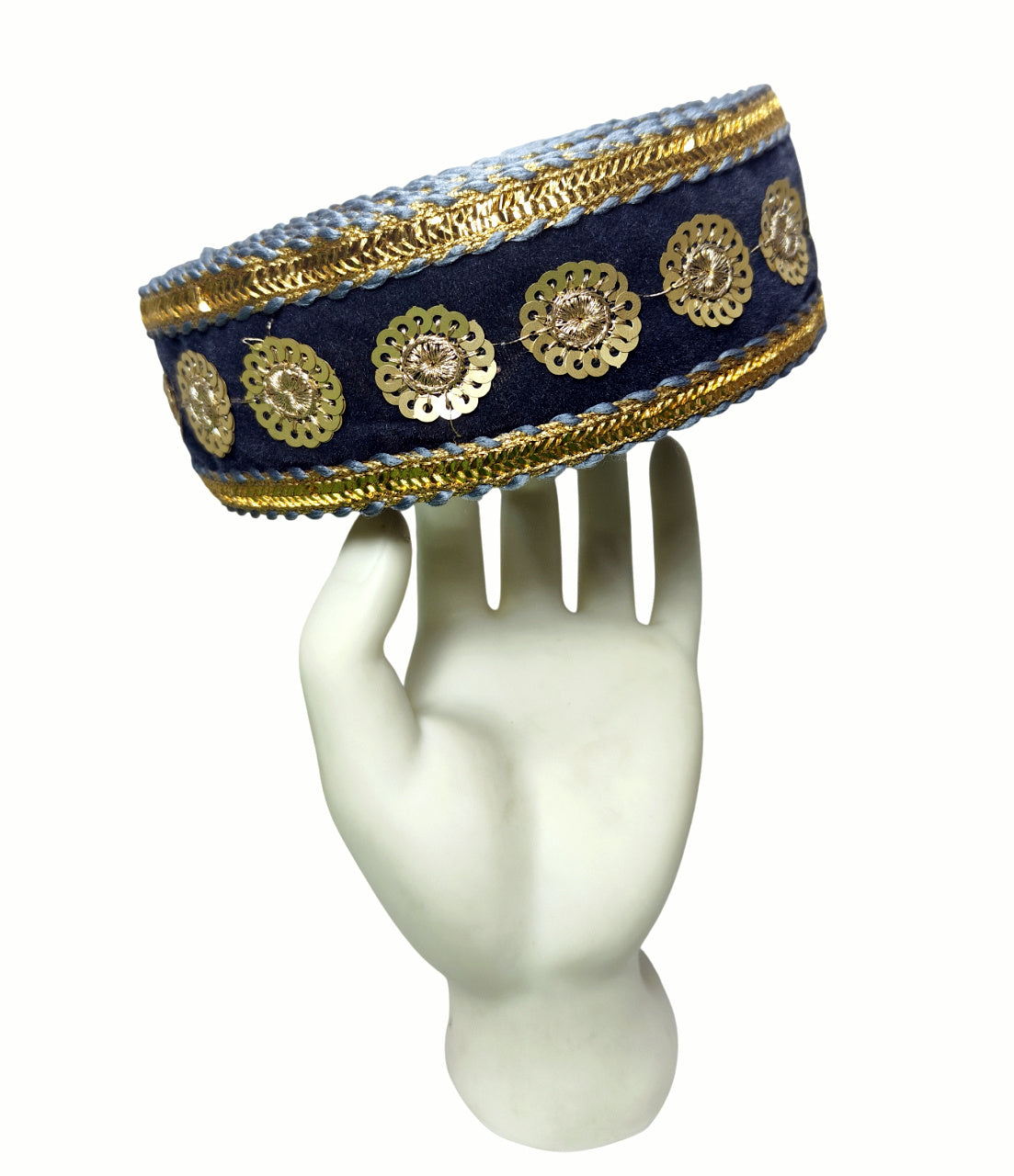 Decorative headband with gold embellishments on a white mannequin head