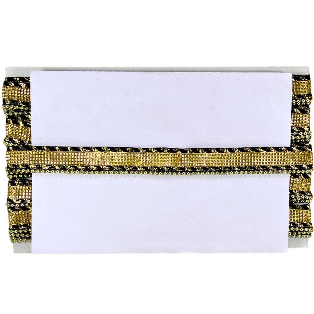 White clutch with gold and black embellishments on a white background