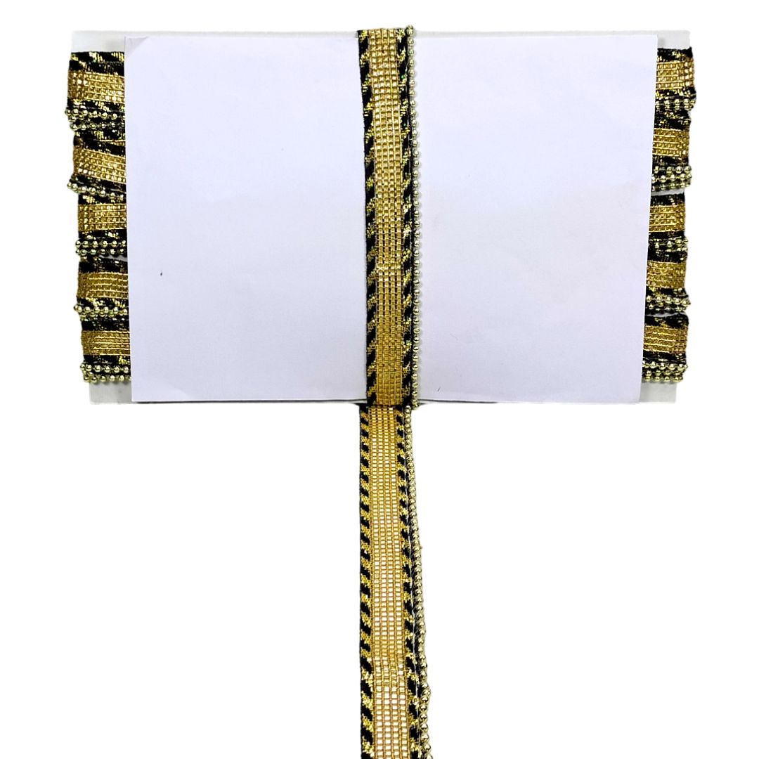 Decorative ribbon with gold and black pattern on a white background