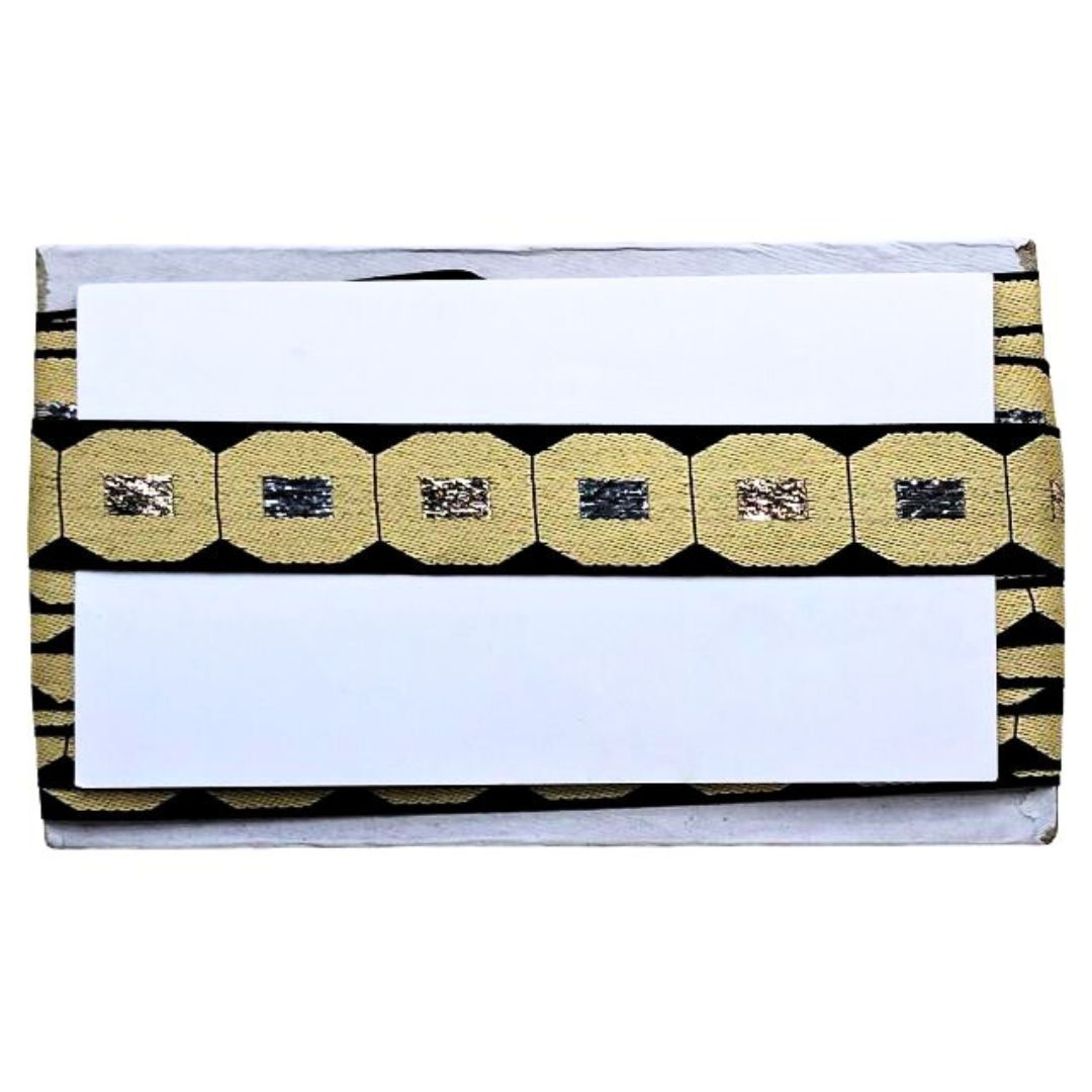 Clutch bag with gold and black pattern on a white background