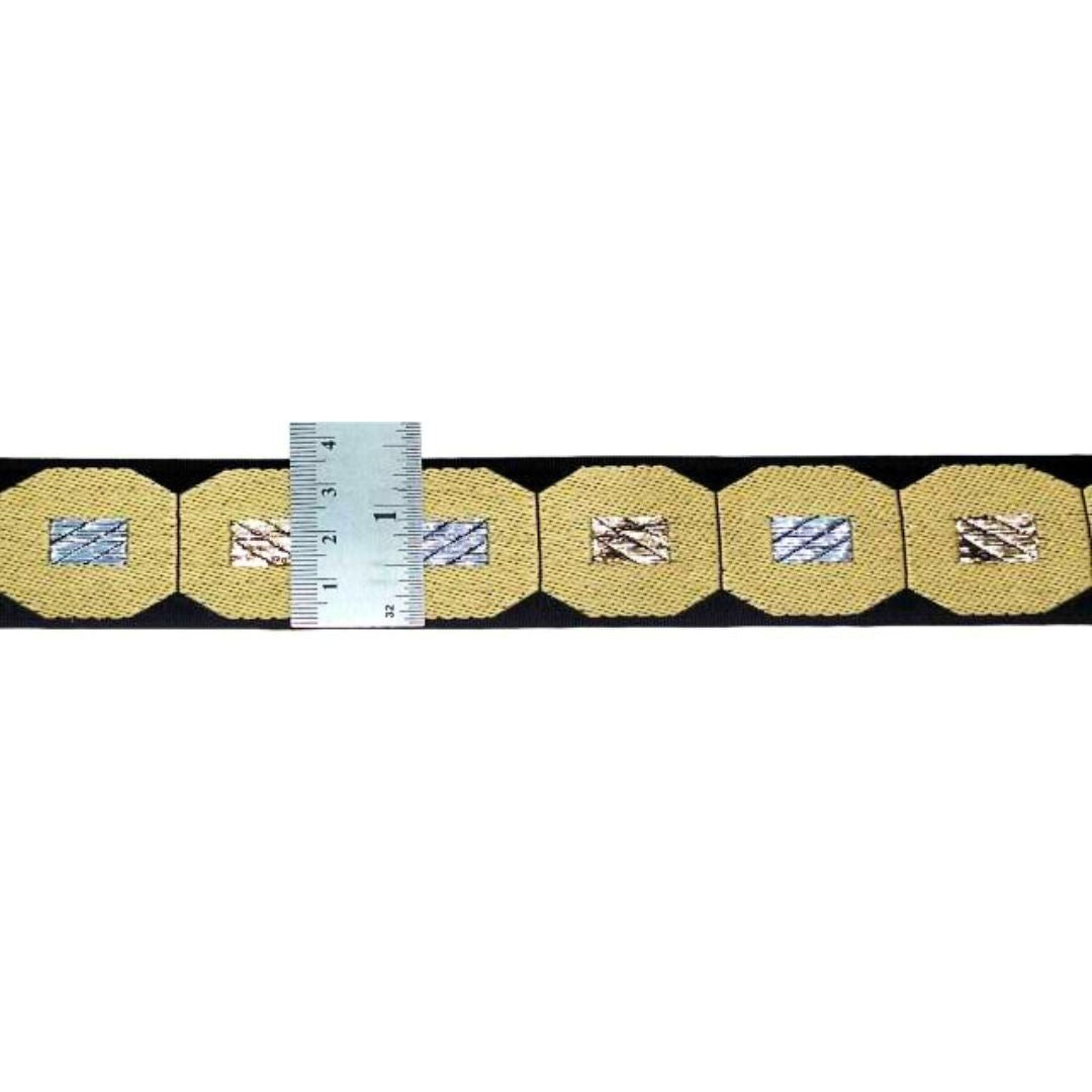 Gold belt with silver buckle and measurement ruler on a white background