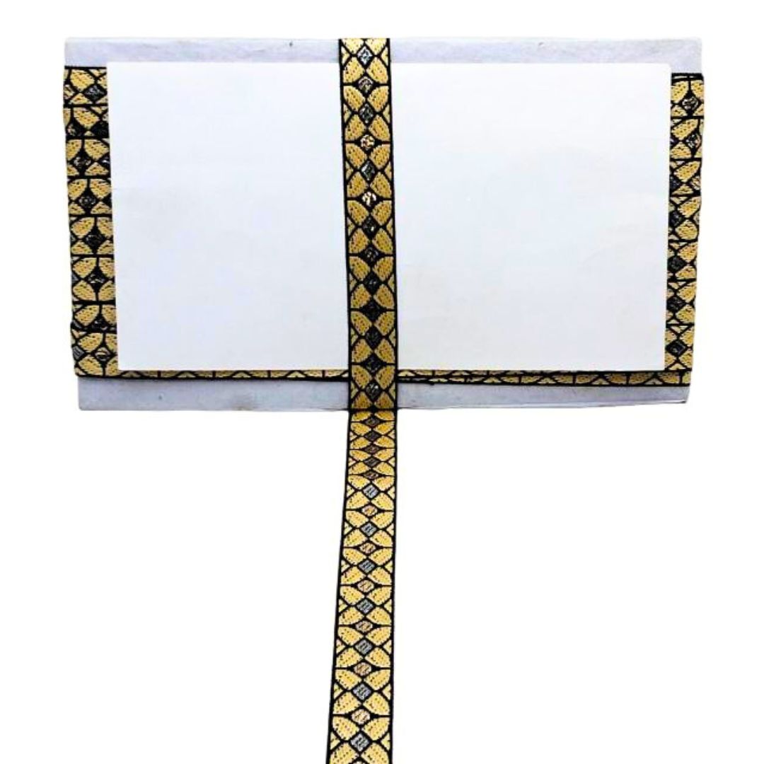 White saree with gold and black border on a white background