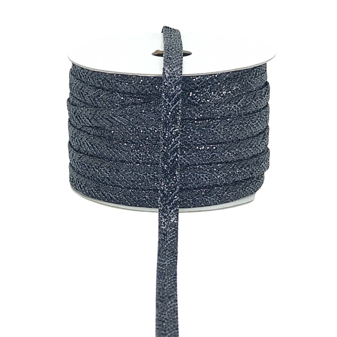 Spool of dark blue glittery cord on a white background