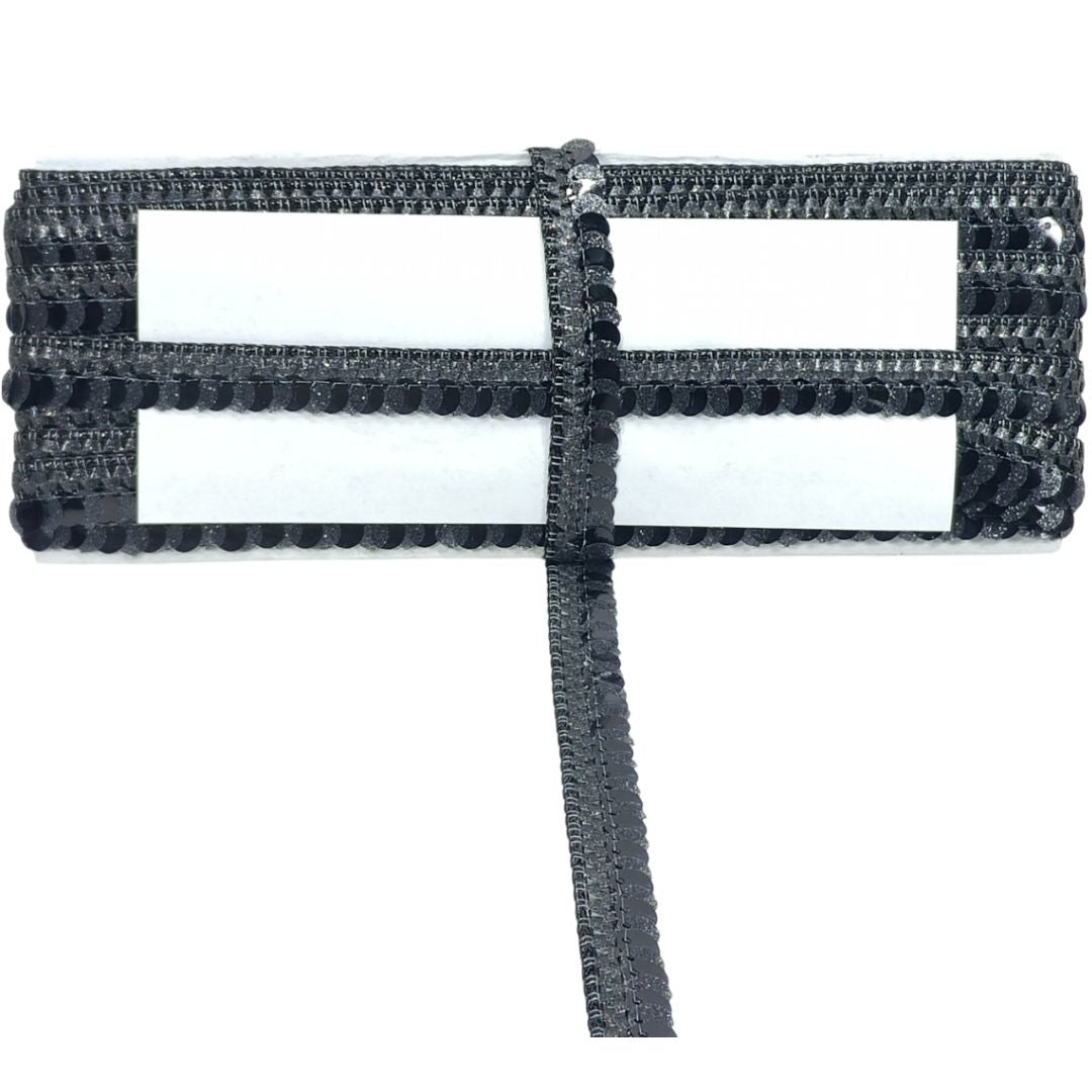 Black woven belt with a rectangular buckle on a white background