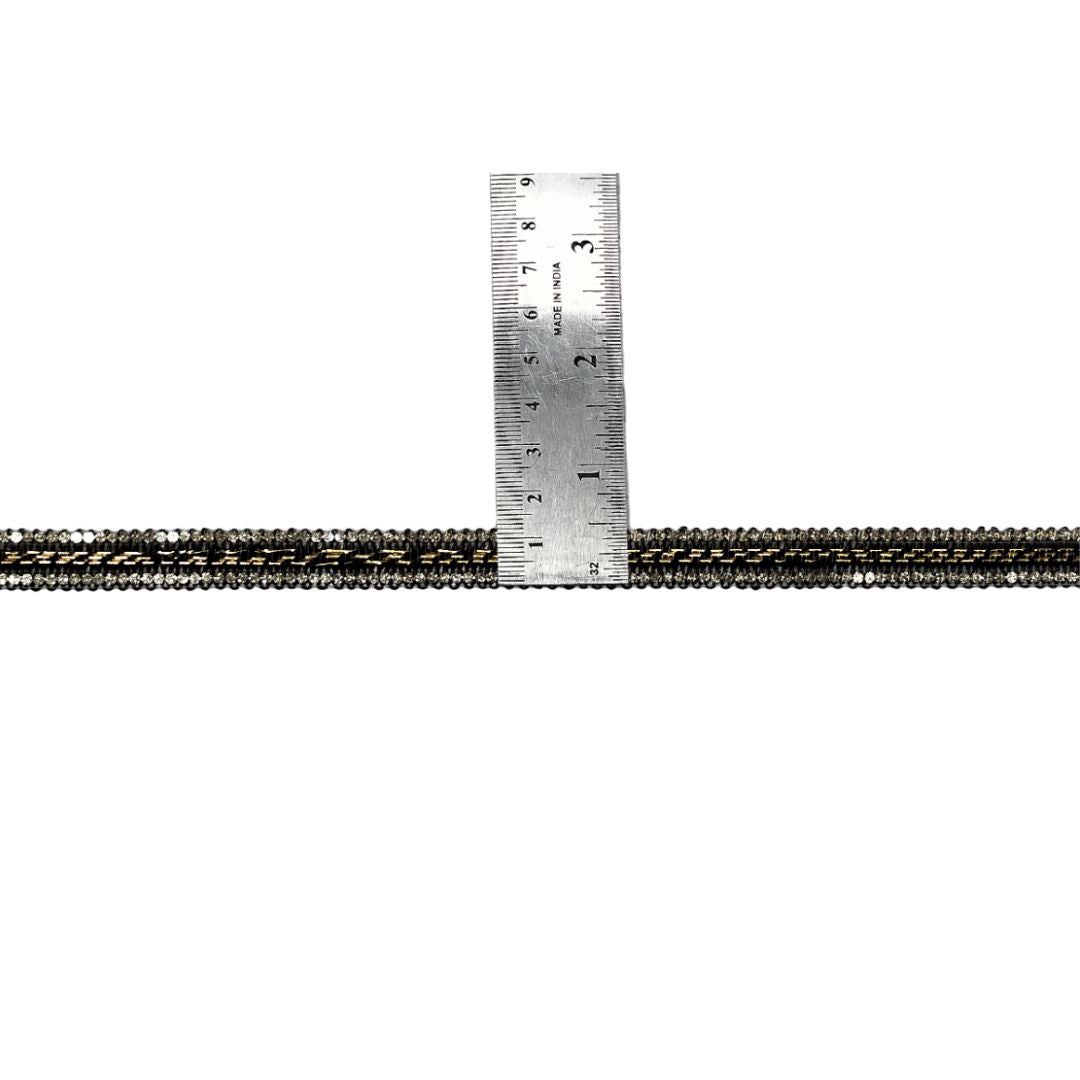 Metallic cord with a ruler showing measurements on a white background