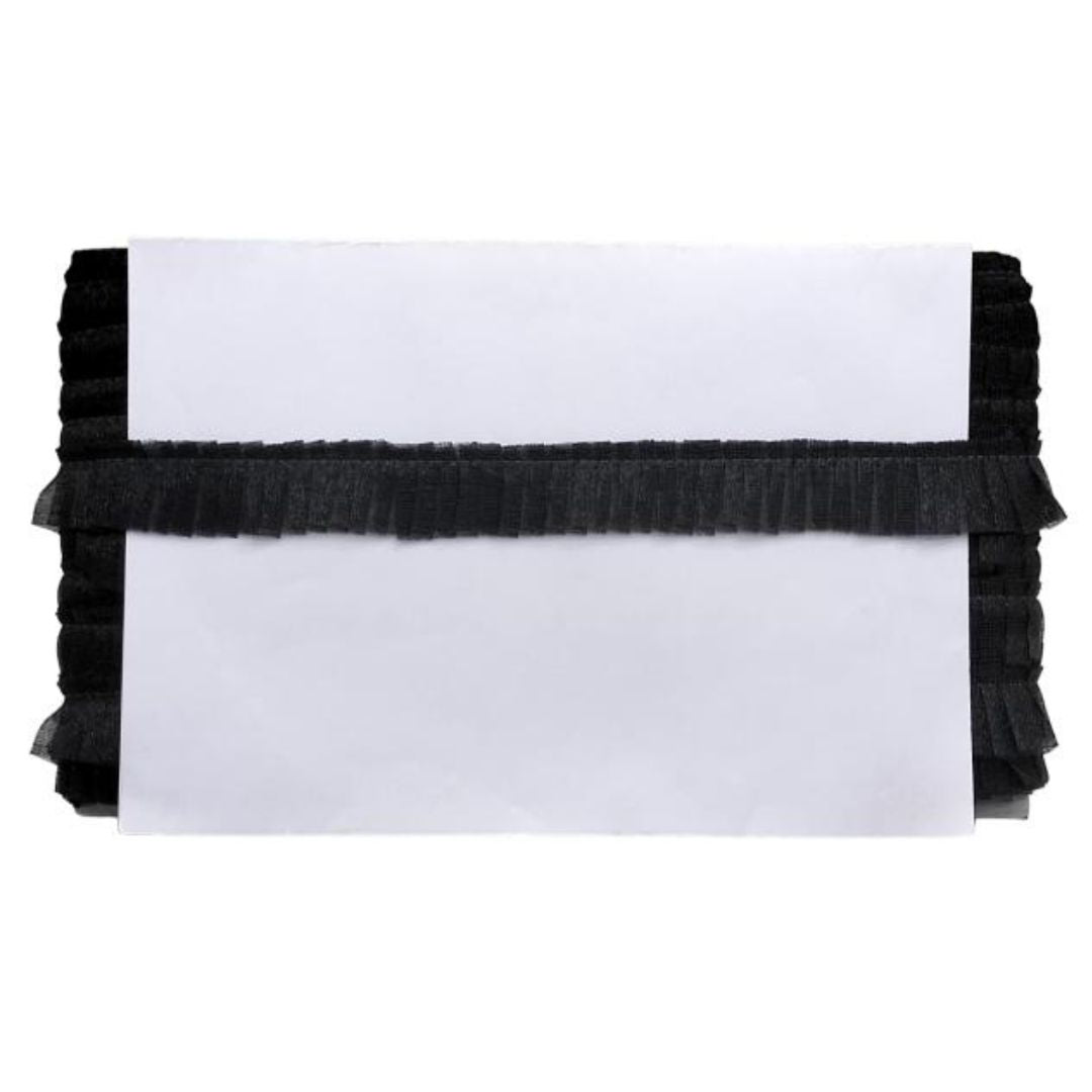 White card with black ruffled trim on a white background