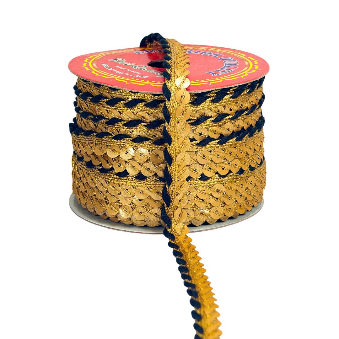 Spool of gold and black rope with a pink label on a white background