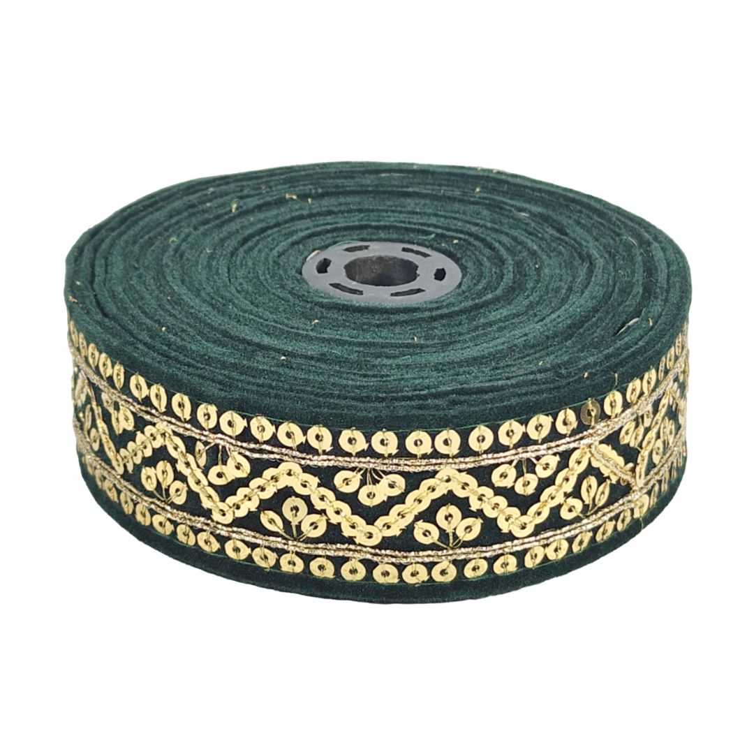 Green ribbon with gold decorative pattern on a white background