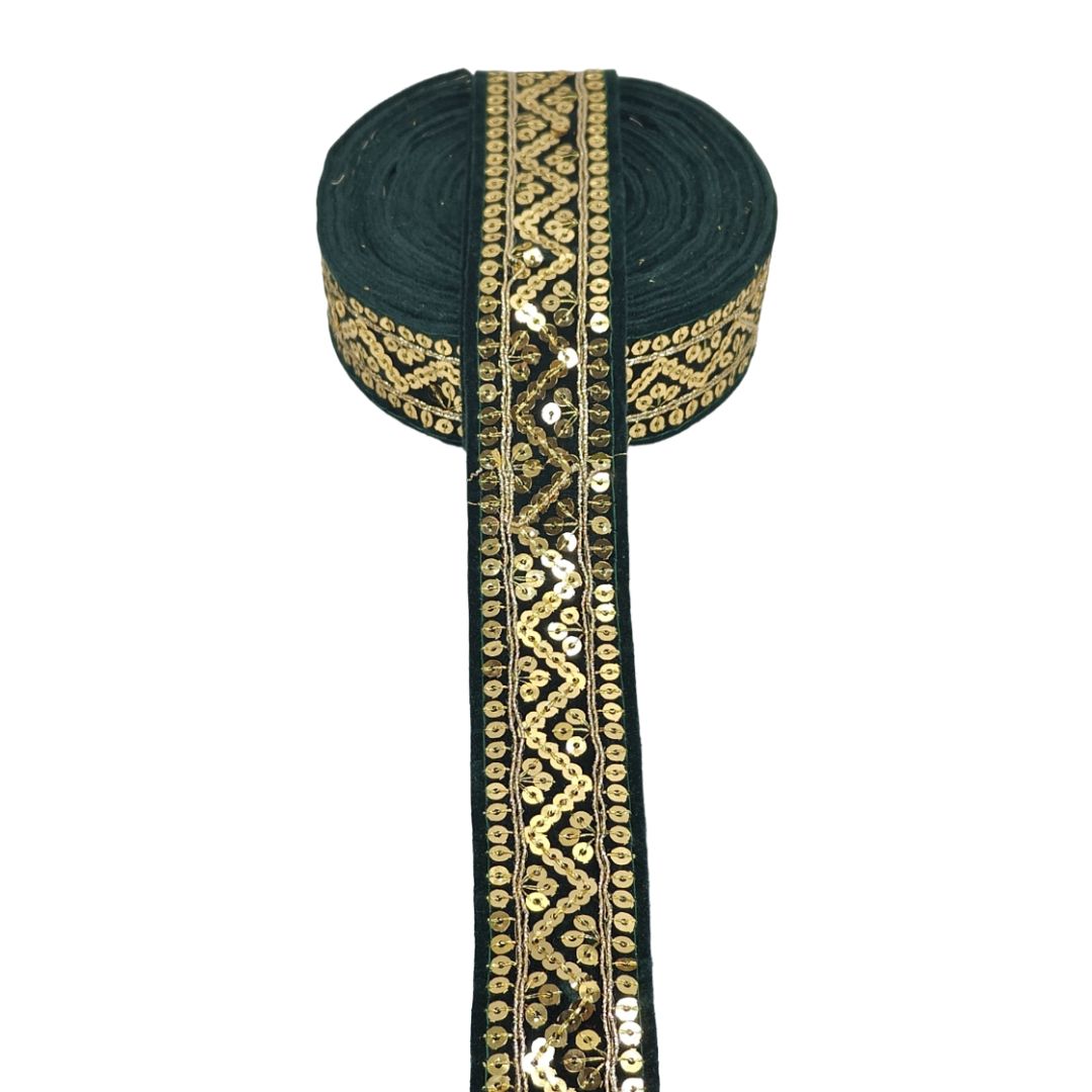 Black ribbon with gold and white pattern on a white background