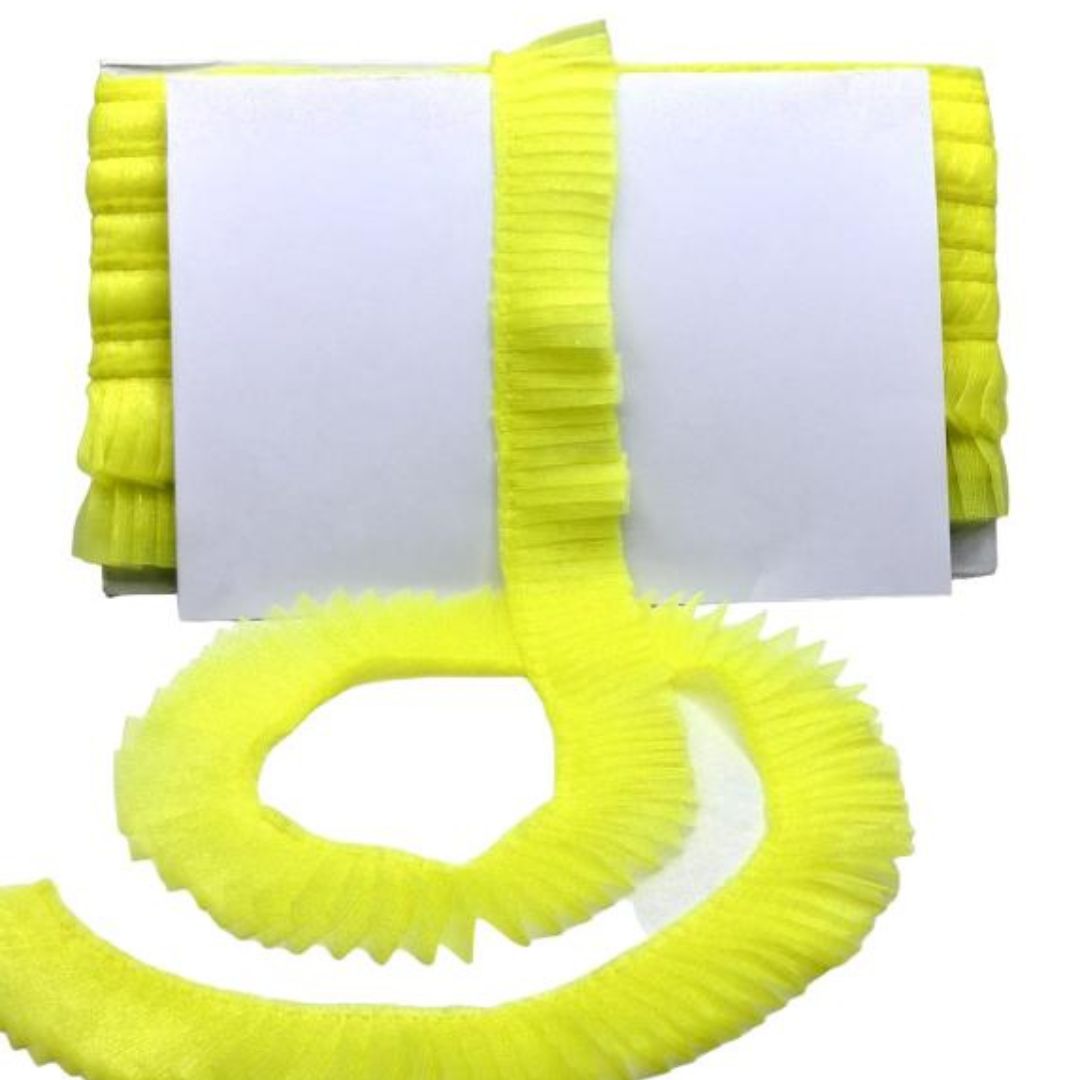 Yellow cleaning brush with a white handle on a white background