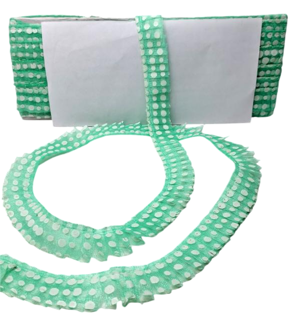 Green polka dot fabric with a white background