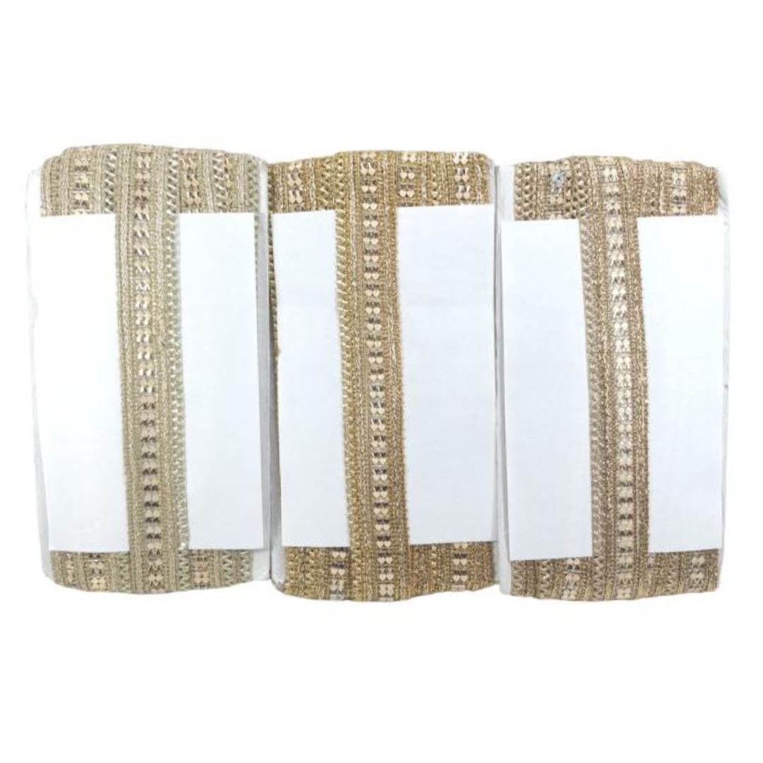 Three white napkins with gold trim on a white background