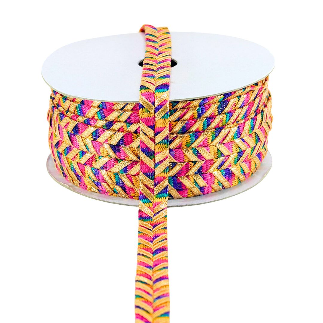 Spool of colorful braided rope on a white background