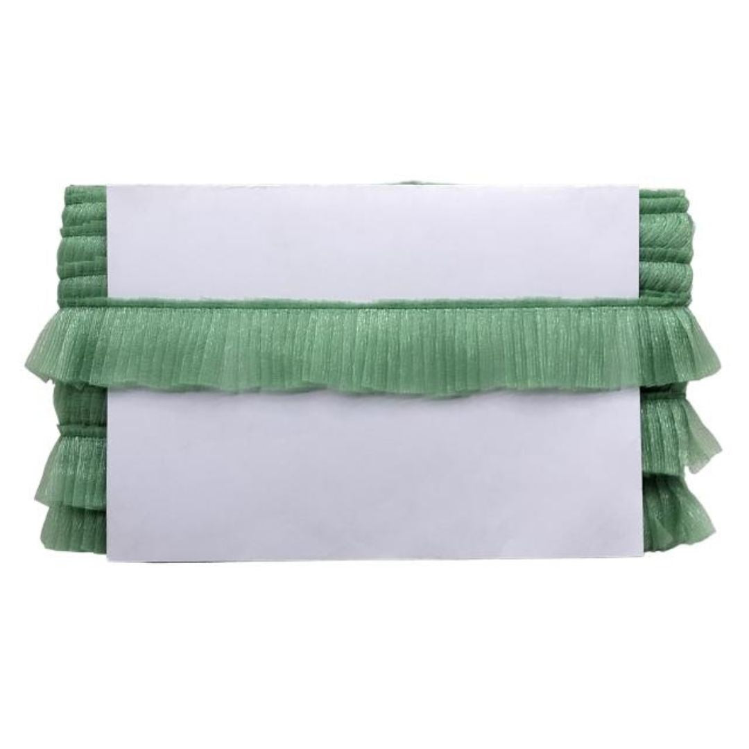 Green ruffled clutch bag on a white background