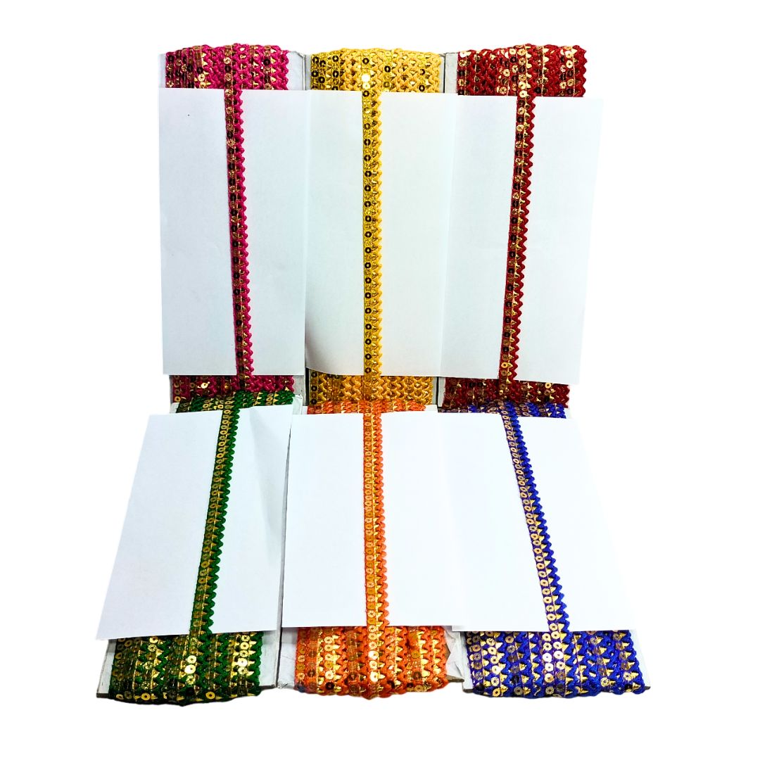 Set of white napkins with colorful sequin borders on a white backgrounds