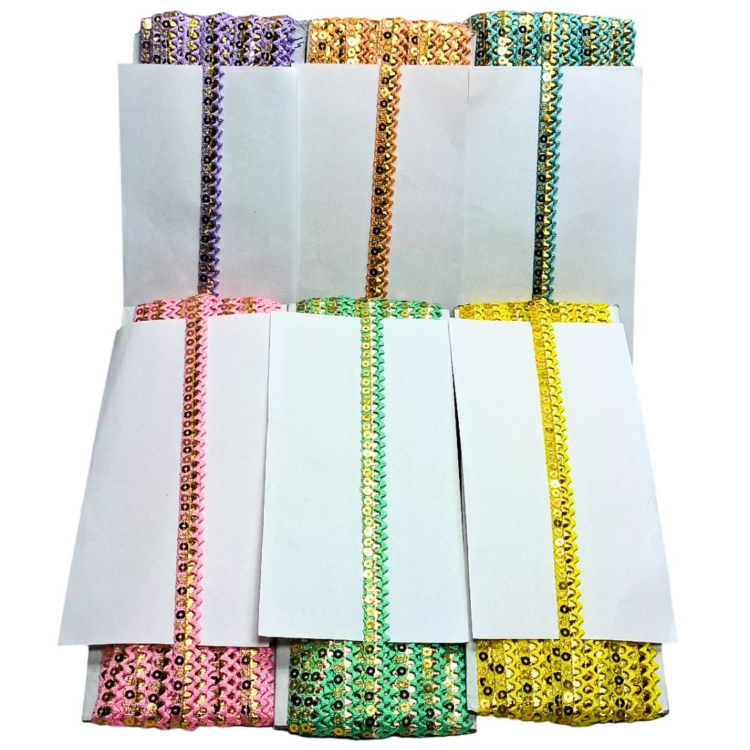Set of white napkins with colorful sequin borders on a white background