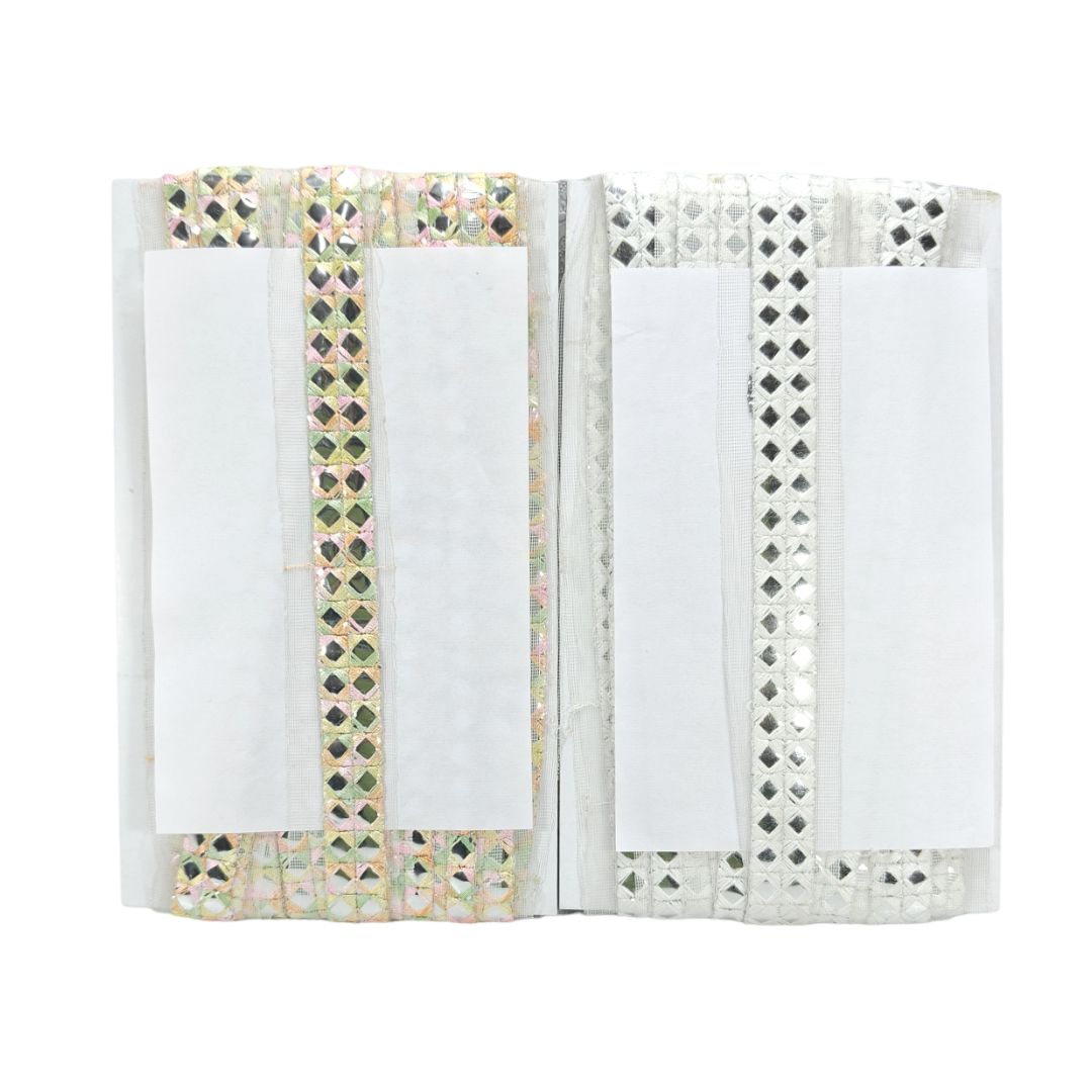 Open book with decorative pages on a white background